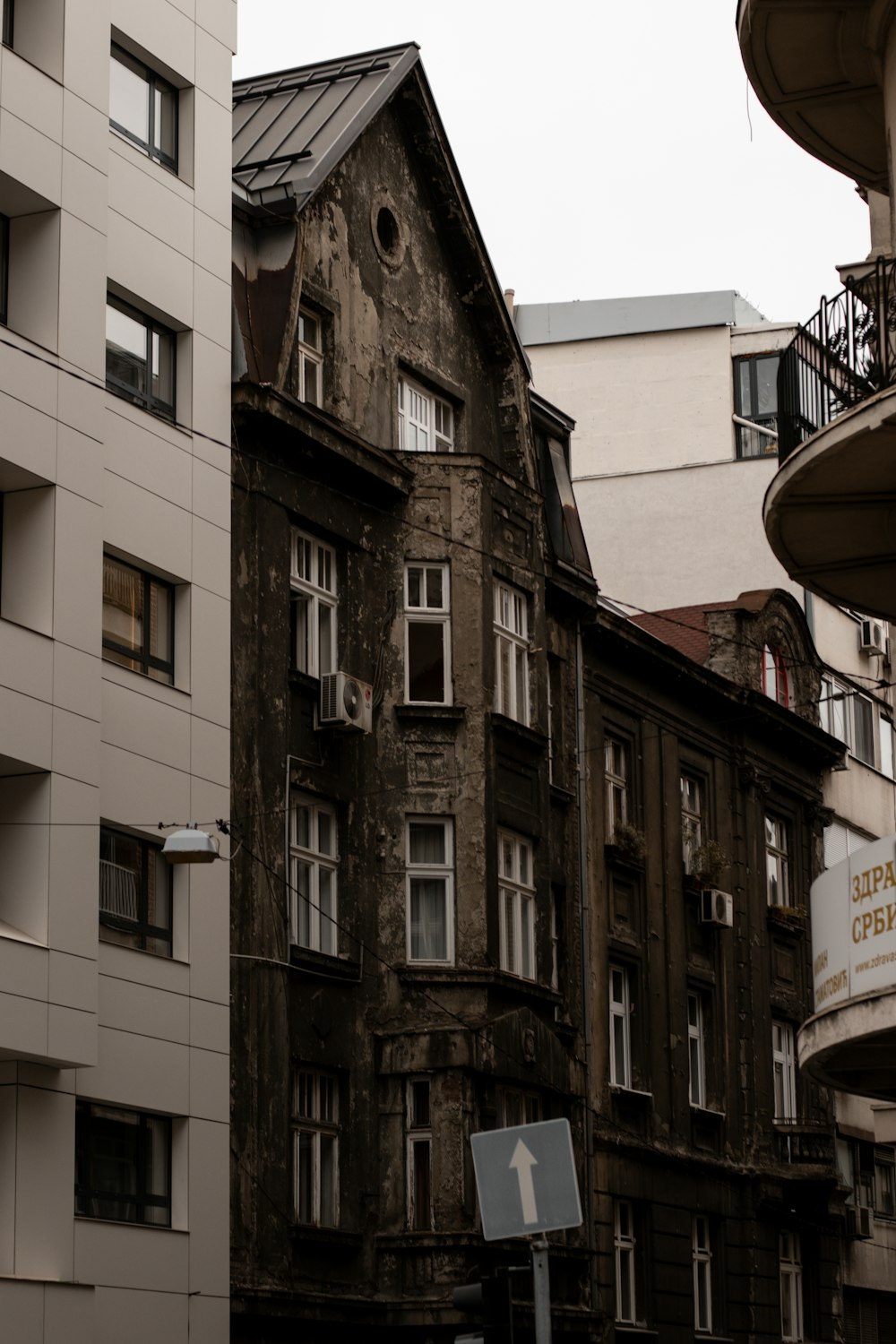 an old building with a sign in front of it