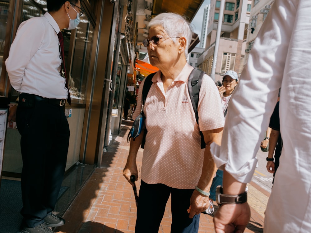 a man and a woman walking down a sidewalk