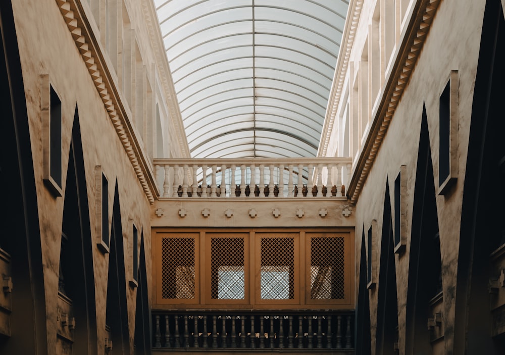 a building with a glass roof and a balcony