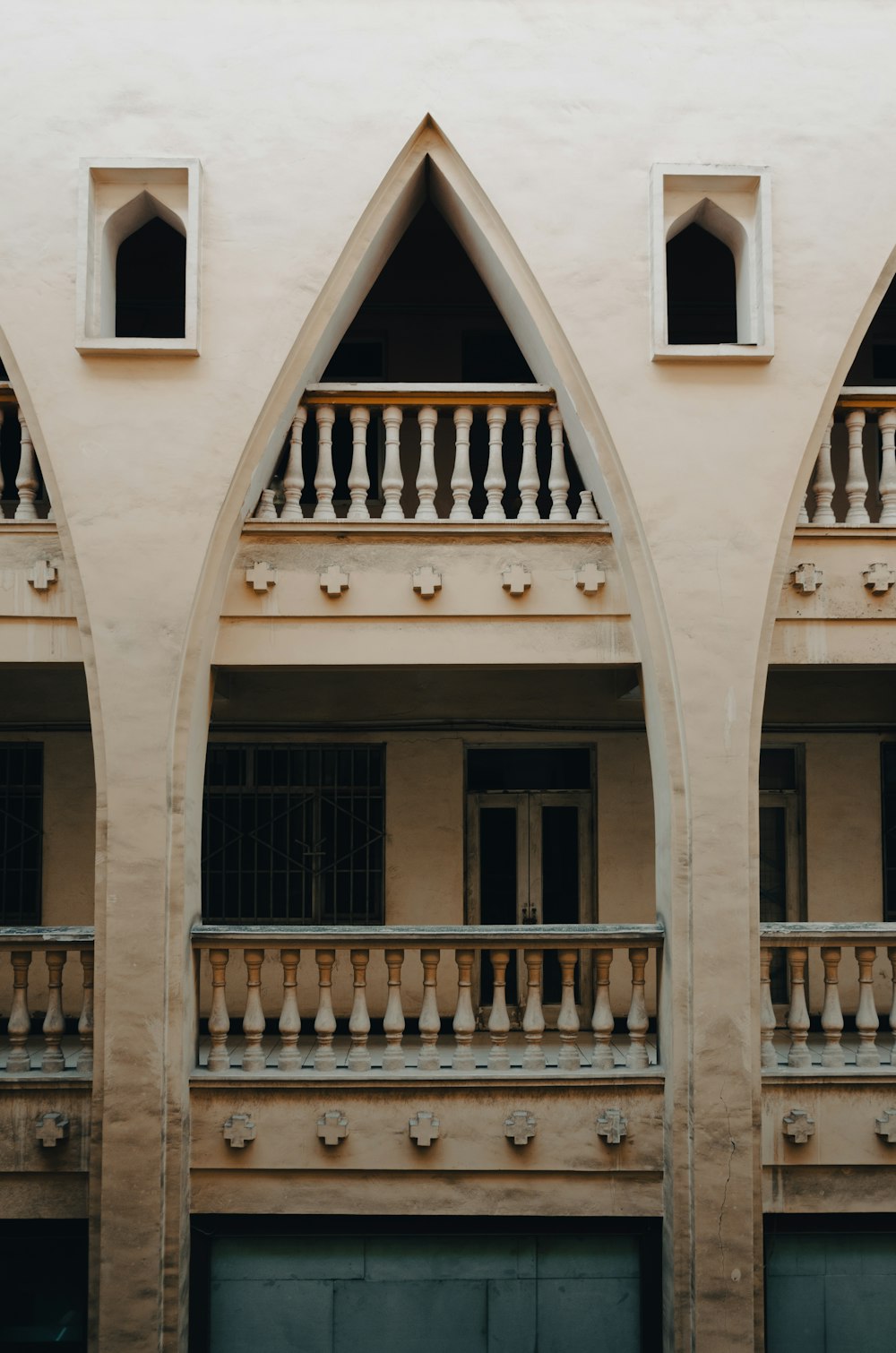 a tall building with three balconies and a balcony