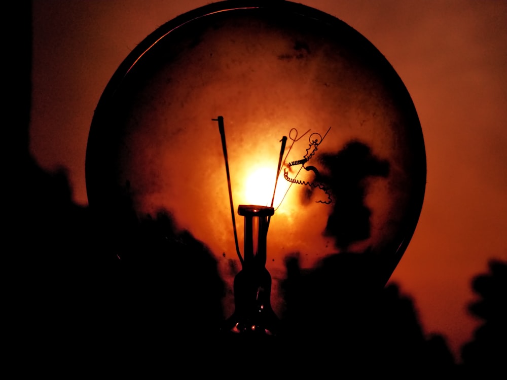 a close up of a street light in the dark