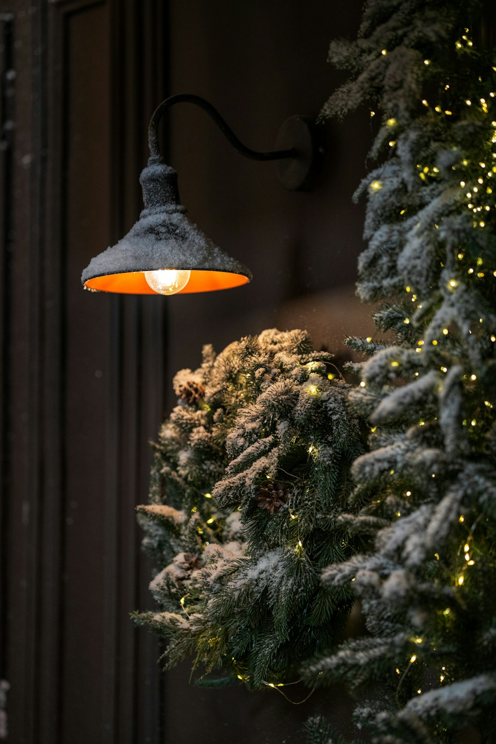 a lamp hanging from the side of a building