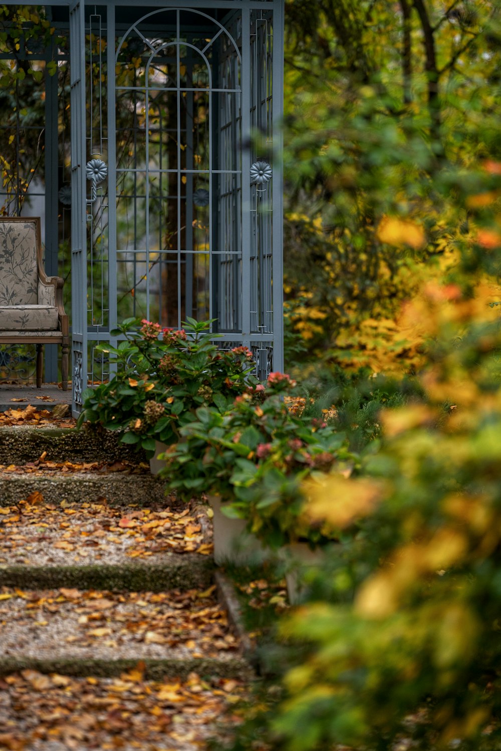 a wooden bench sitting in the middle of a garden