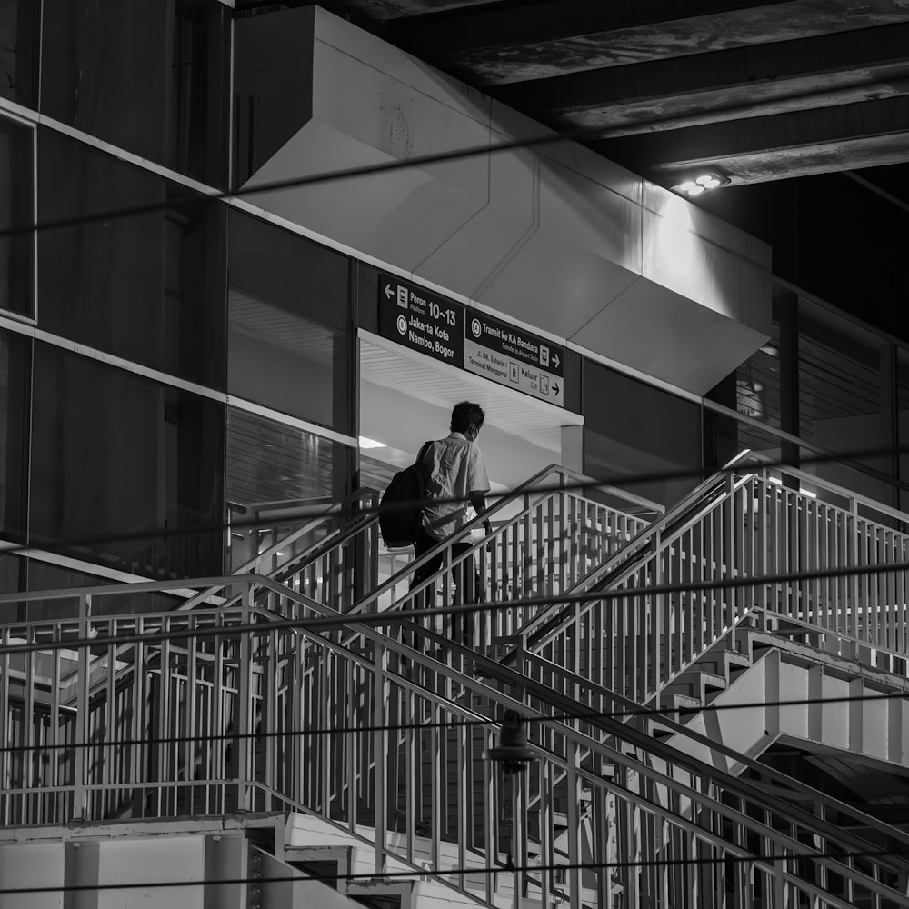 a man walking down a flight of stairs
