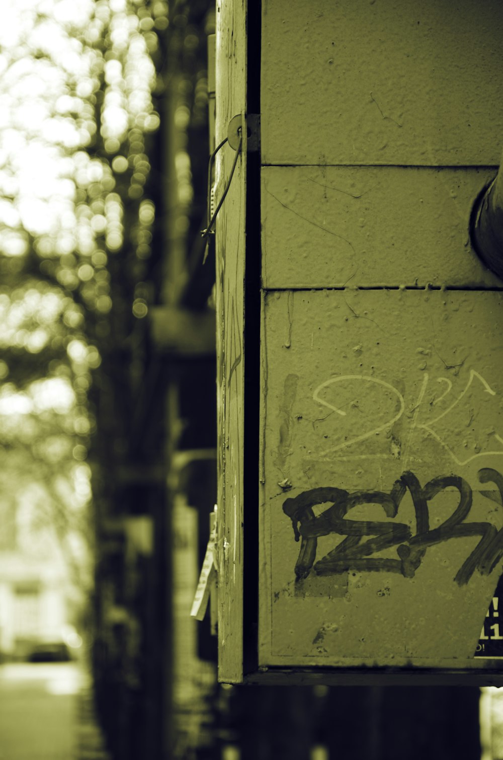 a yellow building with graffiti on the side of it