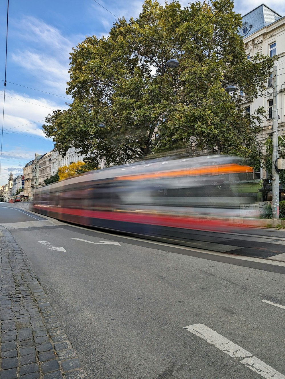 a blurry photo of a train on a street