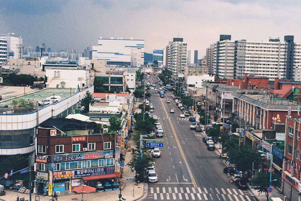 a city street filled with lots of tall buildings