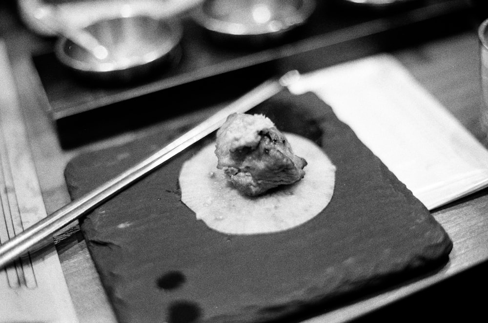 a piece of food sitting on top of a cutting board