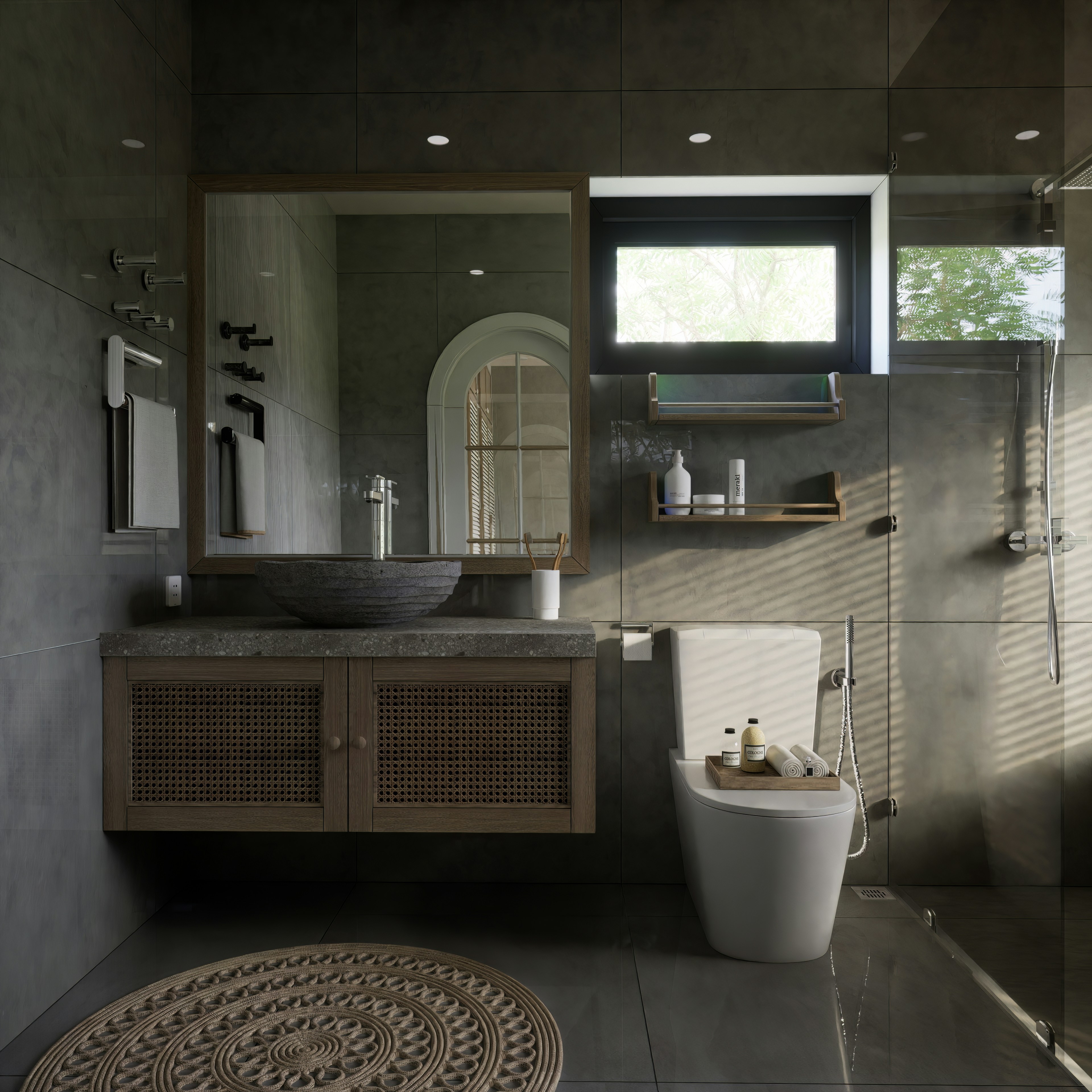Minimalist bathroom with stone basin, dark timber walls, and natural light from a skylight