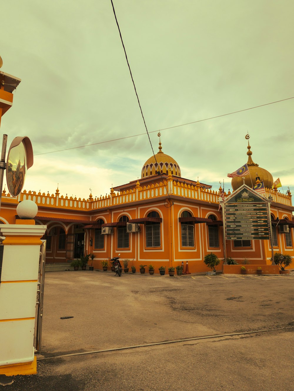 a yellow and white building with a yellow roof