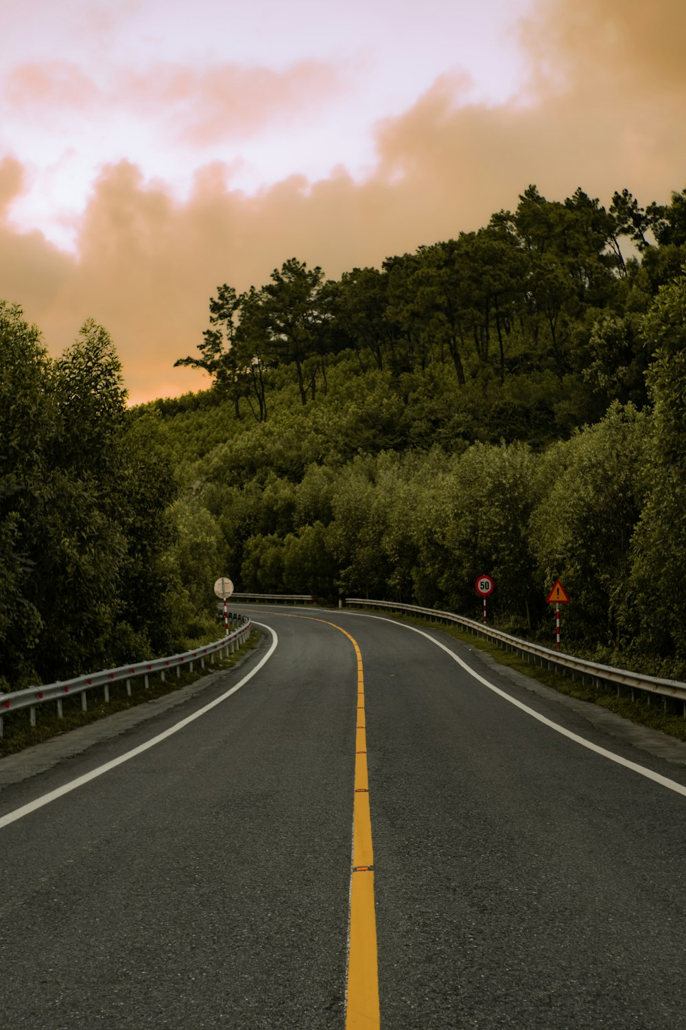 a road with a yellow line on the side of it