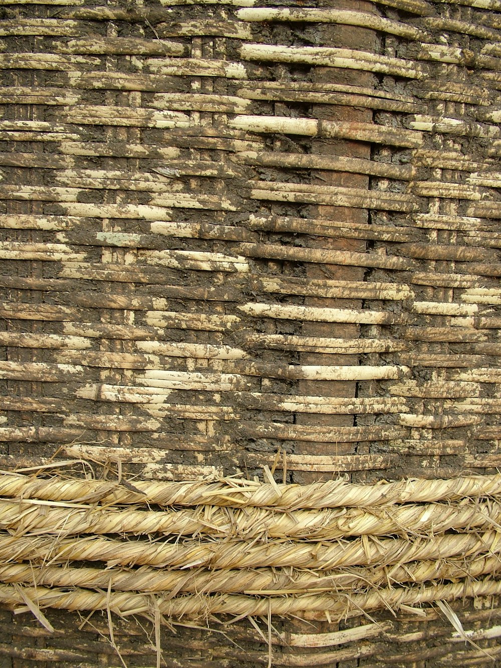 a close up of a wall made of straw