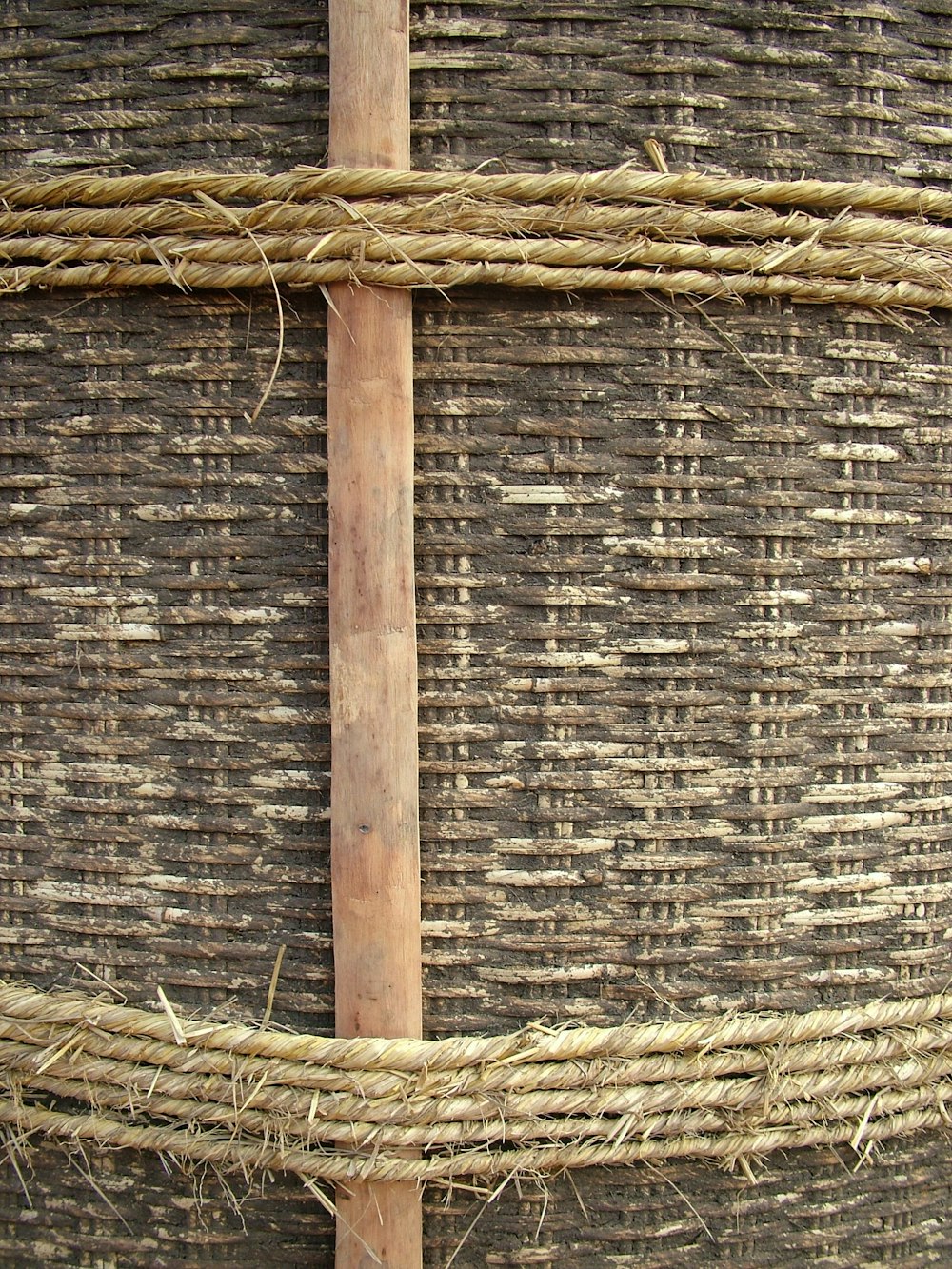 a close up of a piece of wood and rope