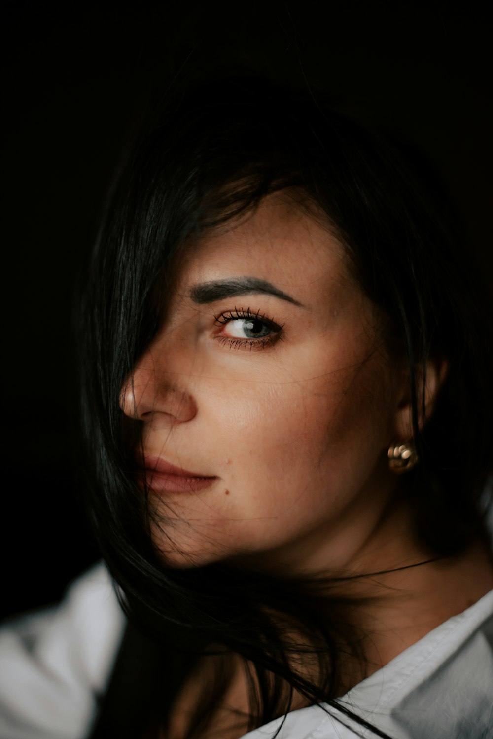 a close up of a person wearing a white shirt
