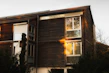 Close-up of a stylish wooden bungalow exterior with large windows