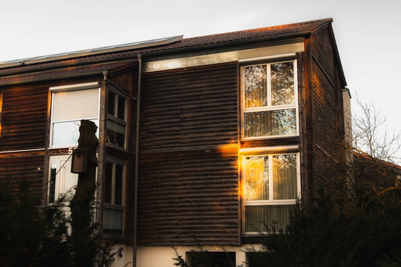 A beautifully crafted wooden home exterior showcasing natural textures and warm tones.