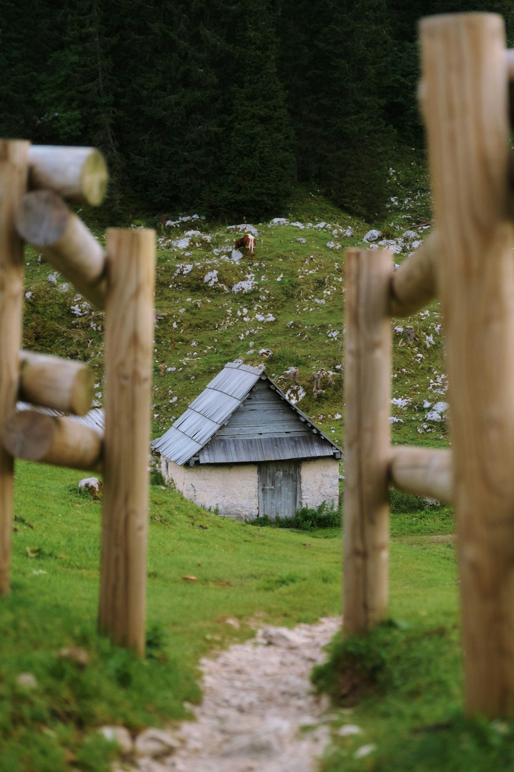 a small house in the middle of a field