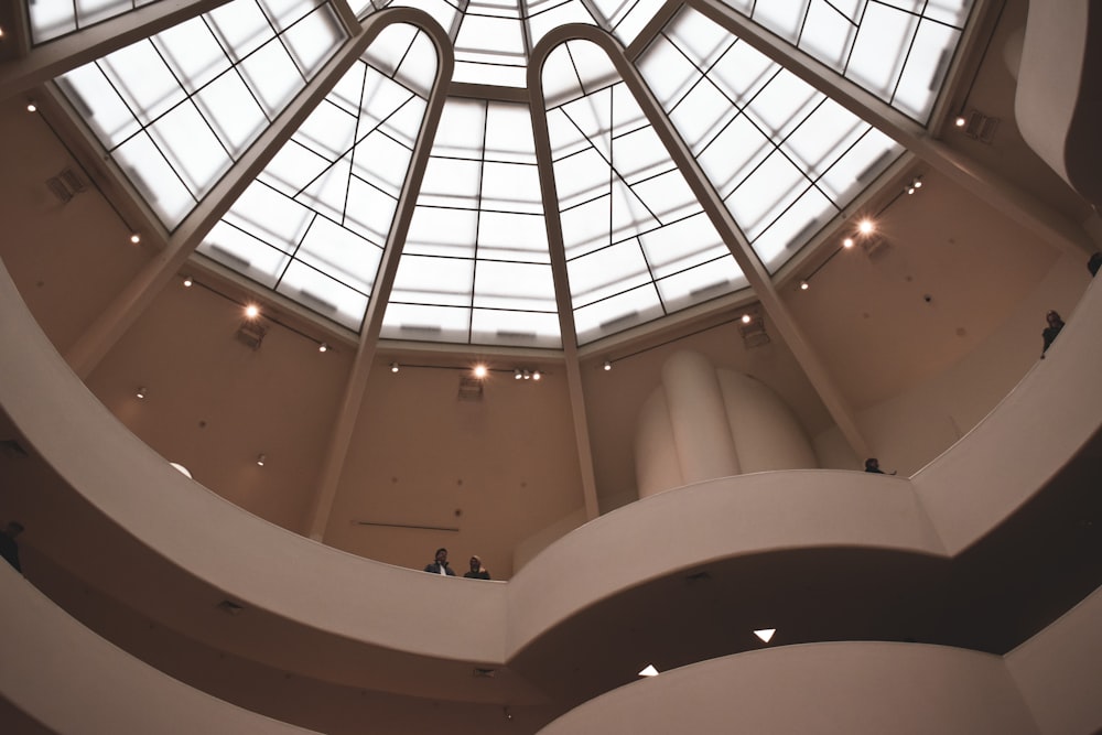 a view of the ceiling of a building with a skylight