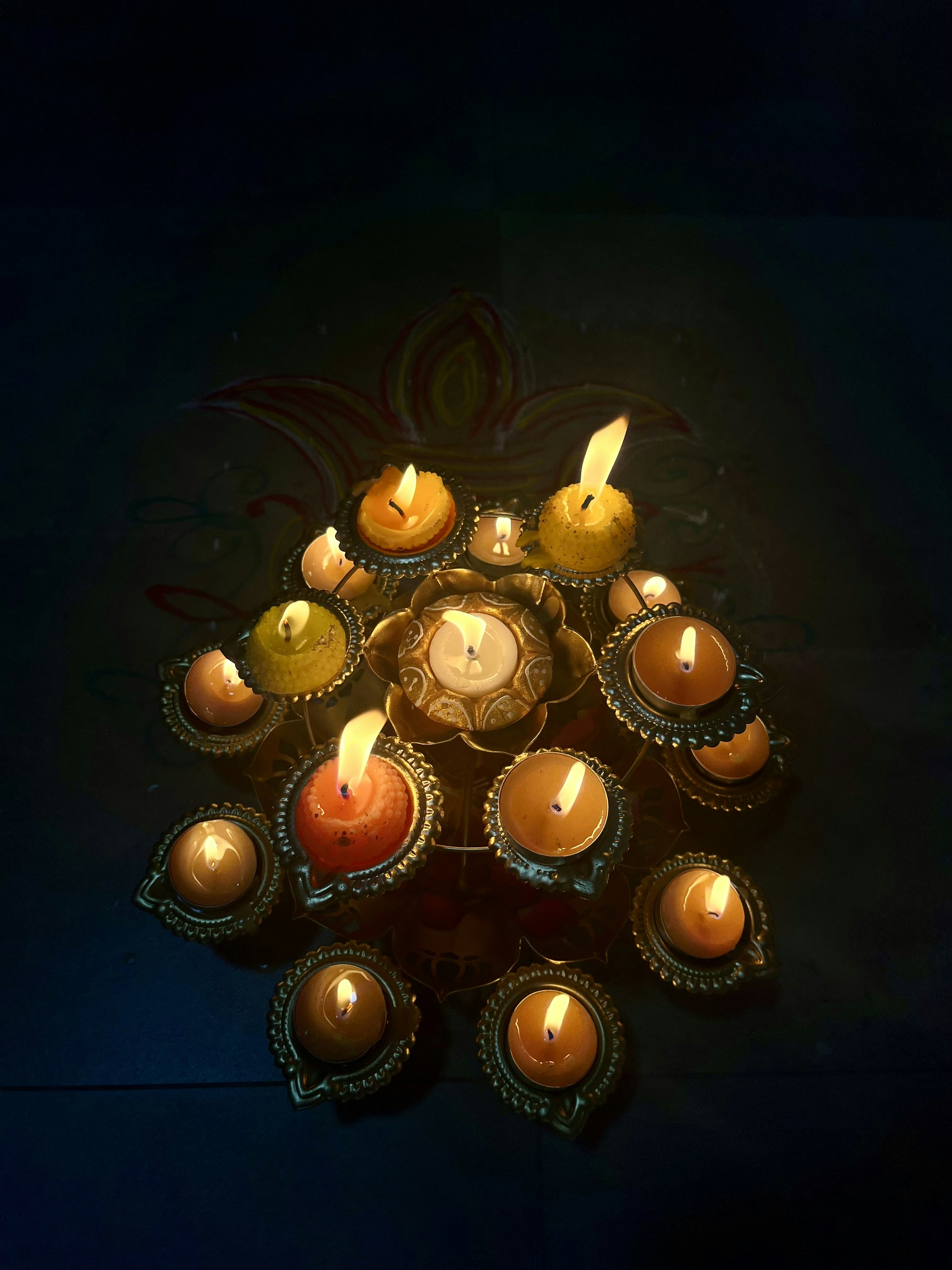 a group of lit candles sitting on top of a table