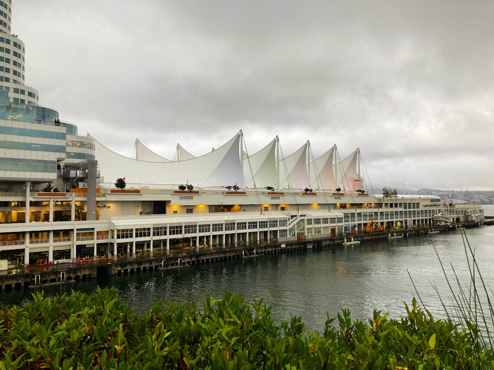 a large building sitting next to a body of water