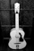 a black and white photo of a guitar