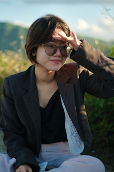 Person wearing modern spectacles outdoors in natural light