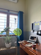 A cozy home office setup with DIY craft materials and a cup of coffee