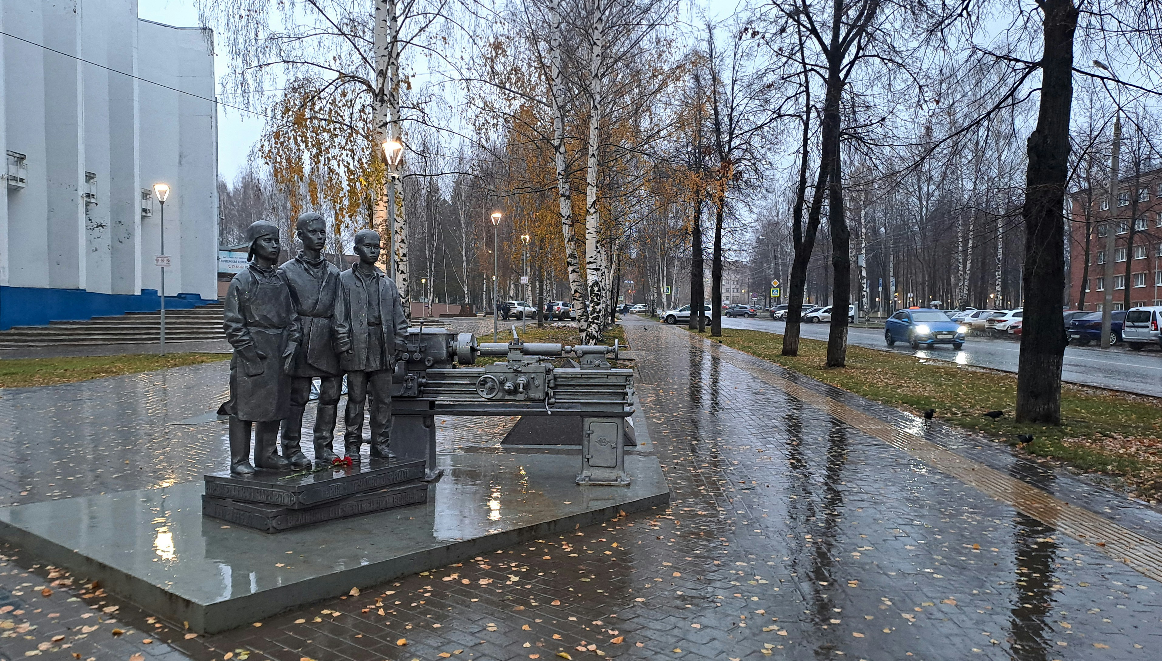a statue of two men standing next to each other