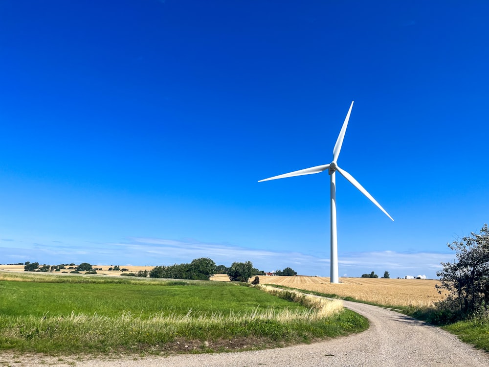 a wind turbine in the middle of a field