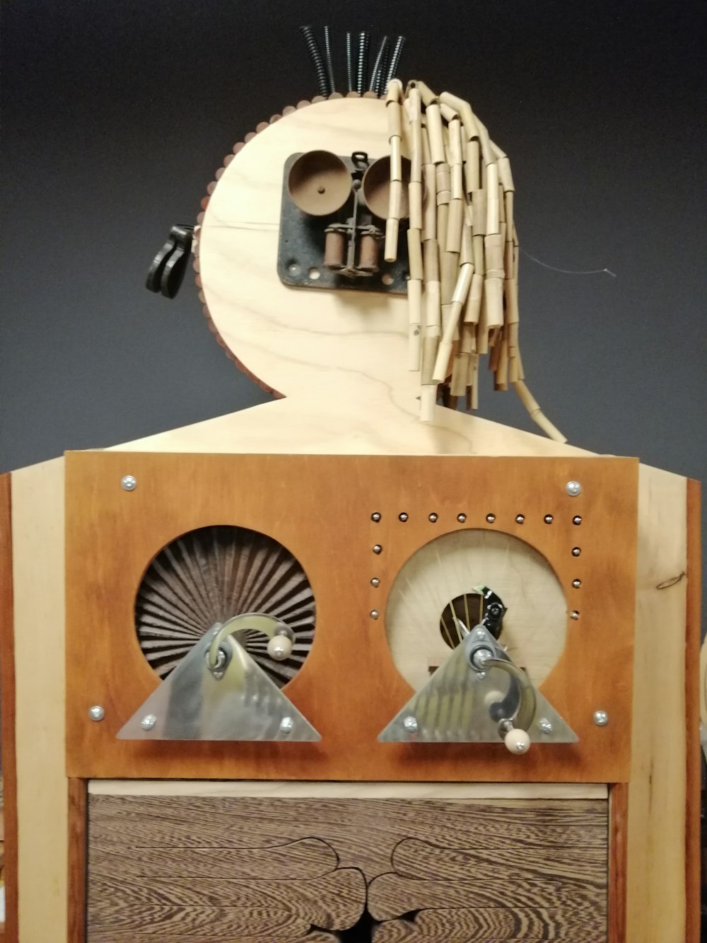 a wooden clock with a face made out of wood