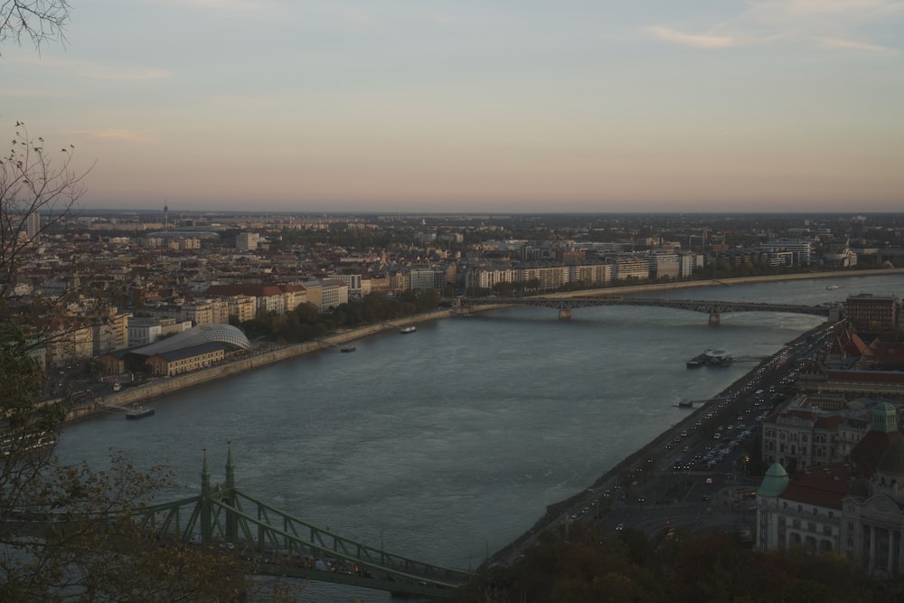 a river running through a city next to a bridge