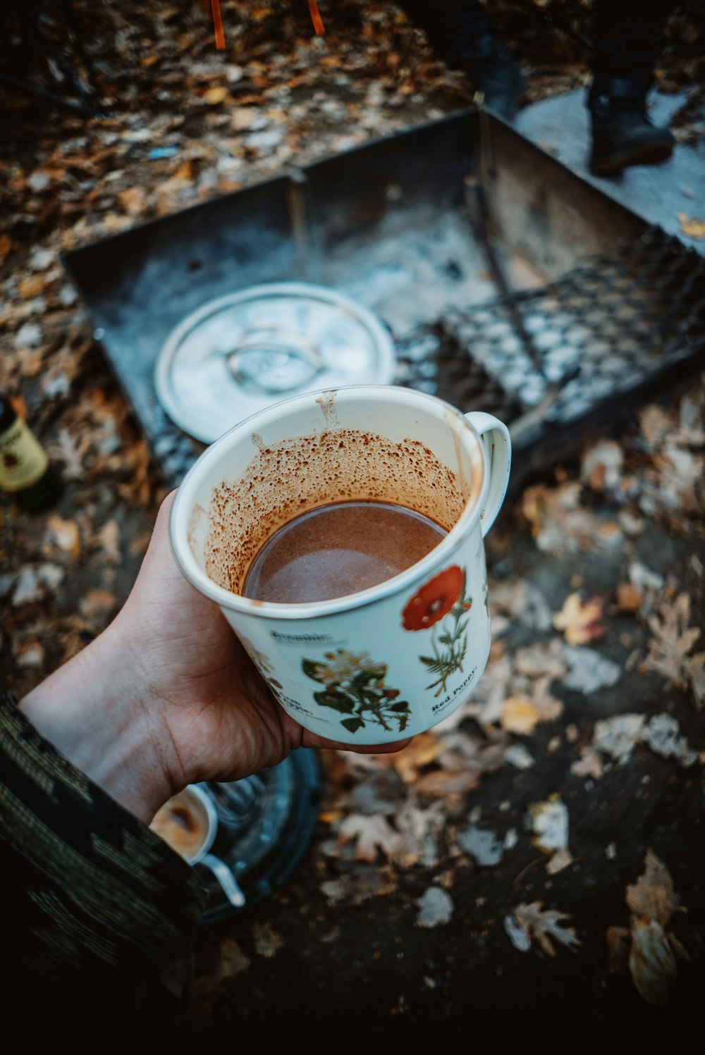 a person holding a cup of hot chocolate