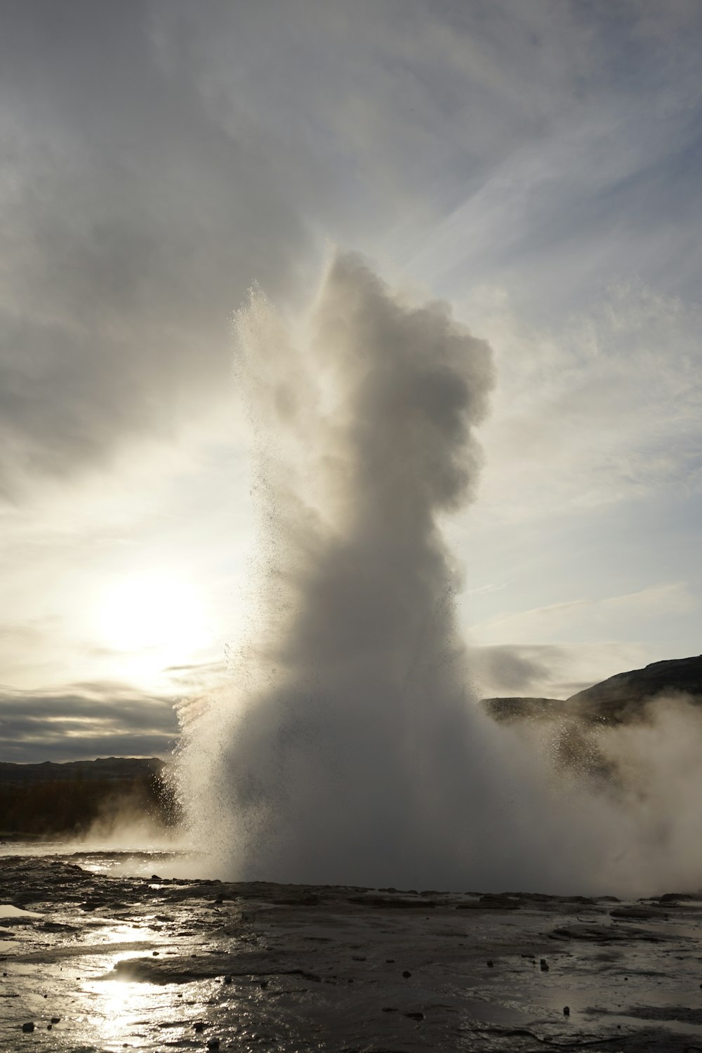 a geyser spewing water into the sky