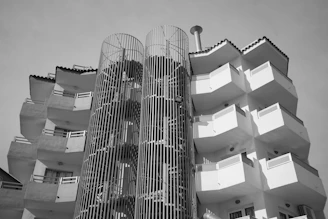 a very tall building with many balconies on it