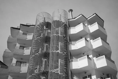 a very tall building with many balconies on it