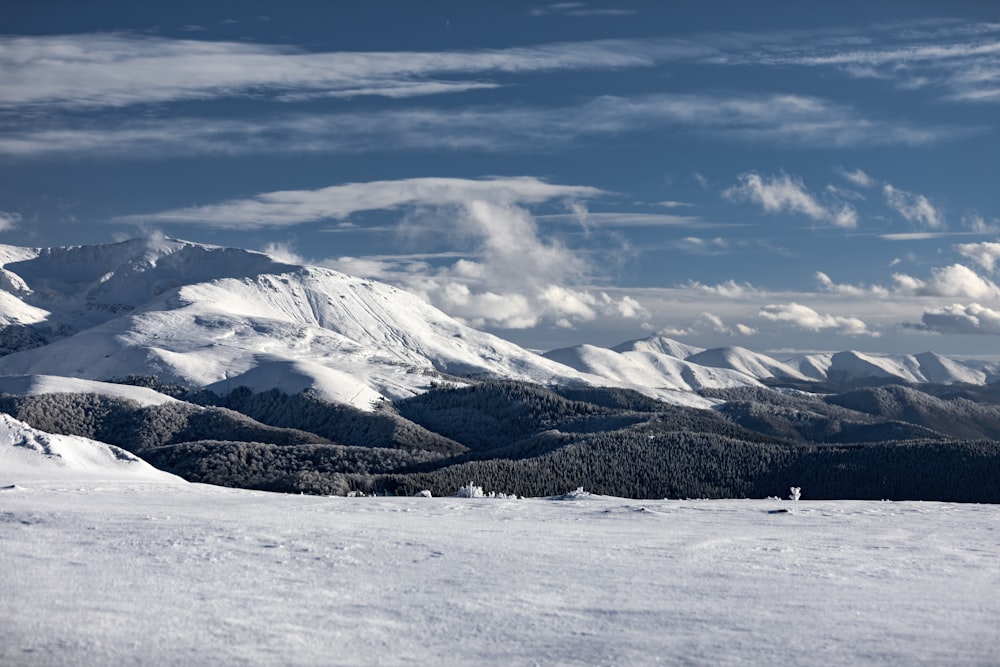 a person standing on a snow covered ski slope