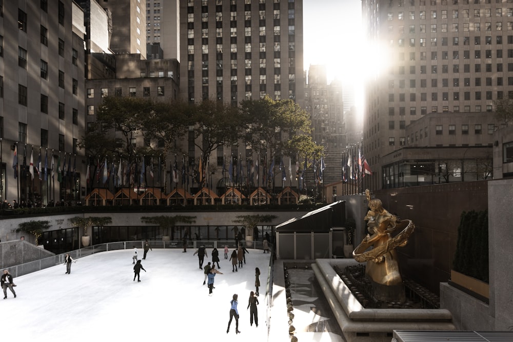 a group of people skating on an ice rink