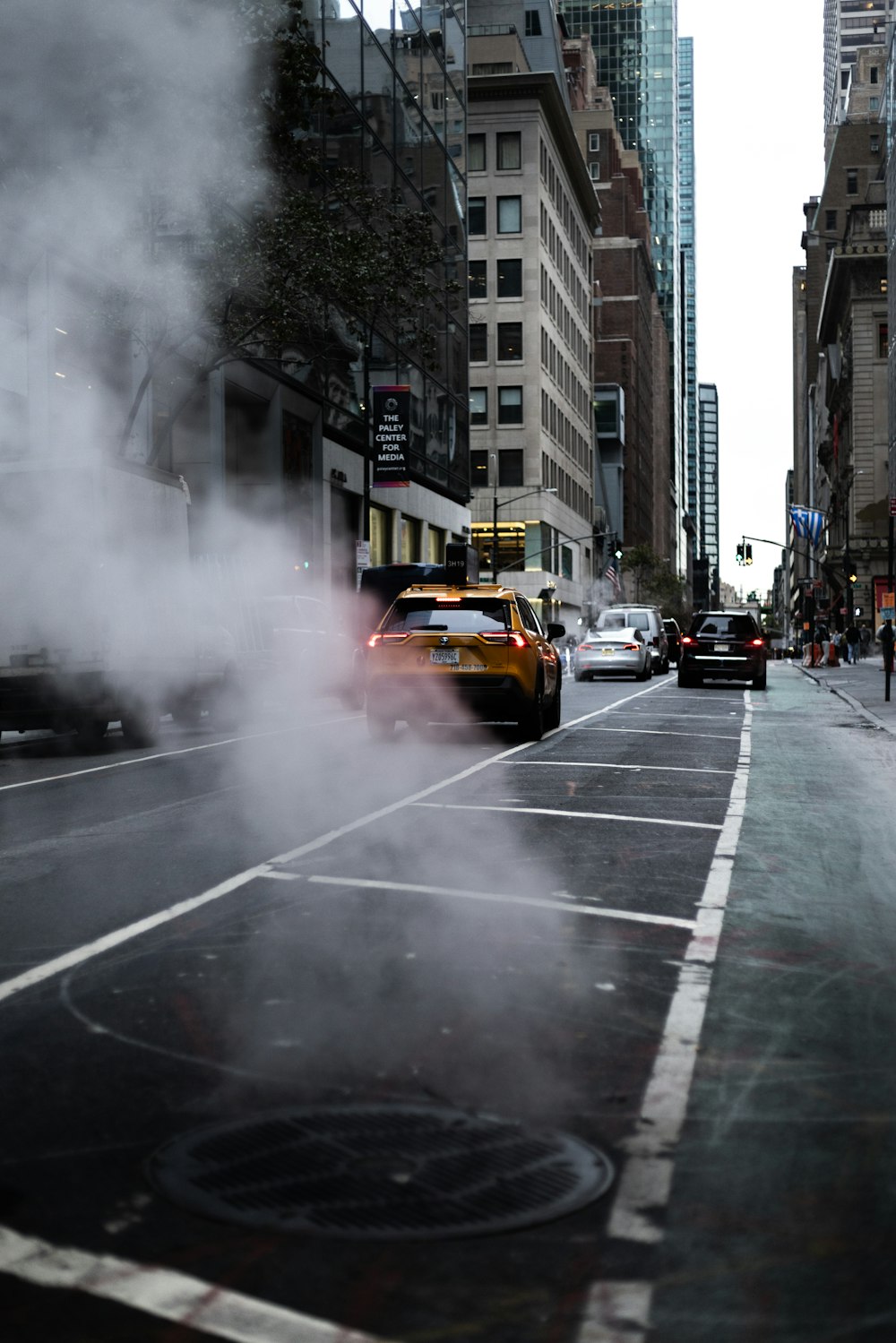 a city street with a lot of smoke coming out of it