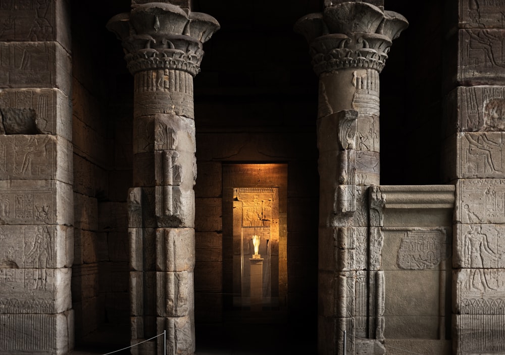 a couple of stone pillars in a building