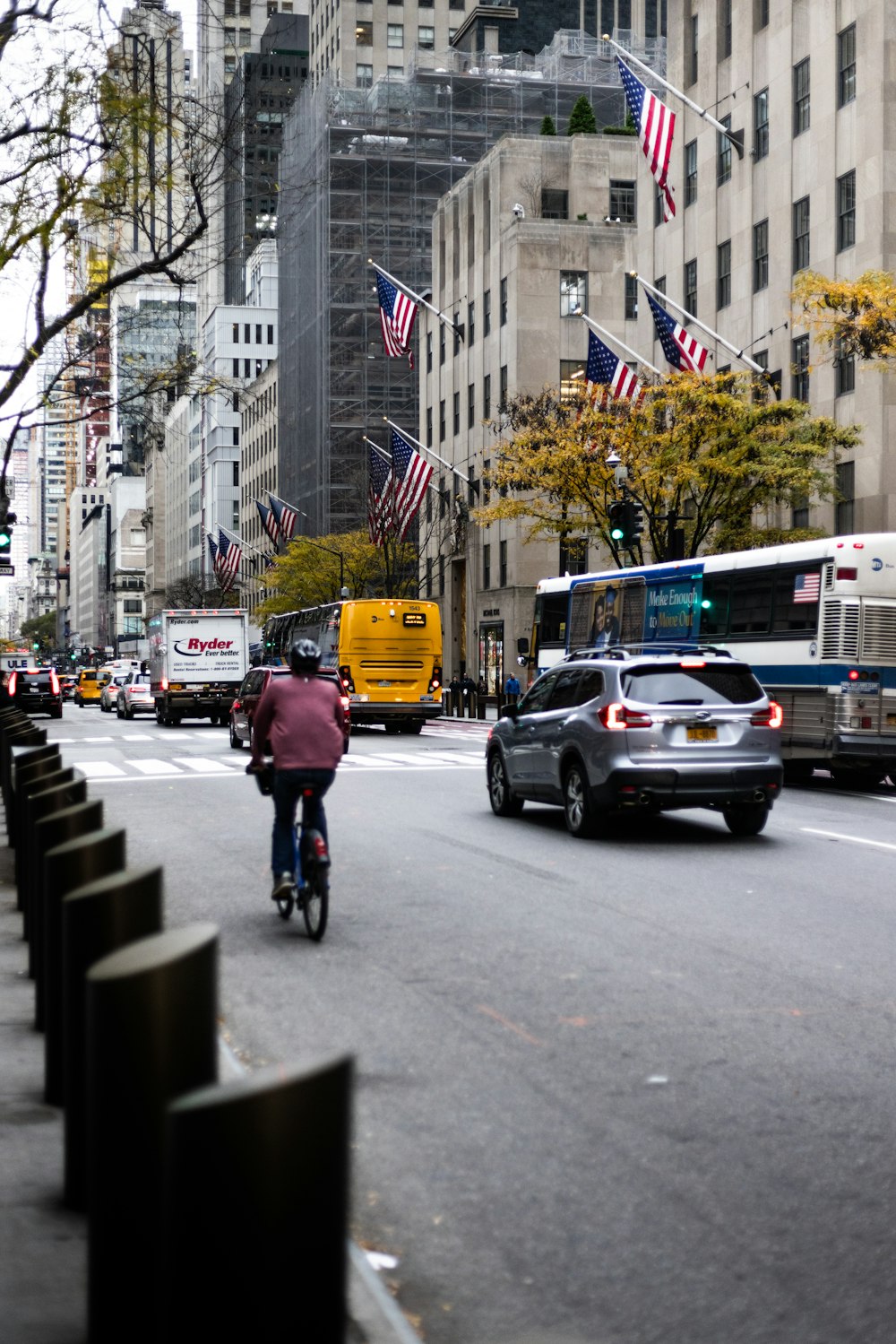 a person riding a bike on a city street