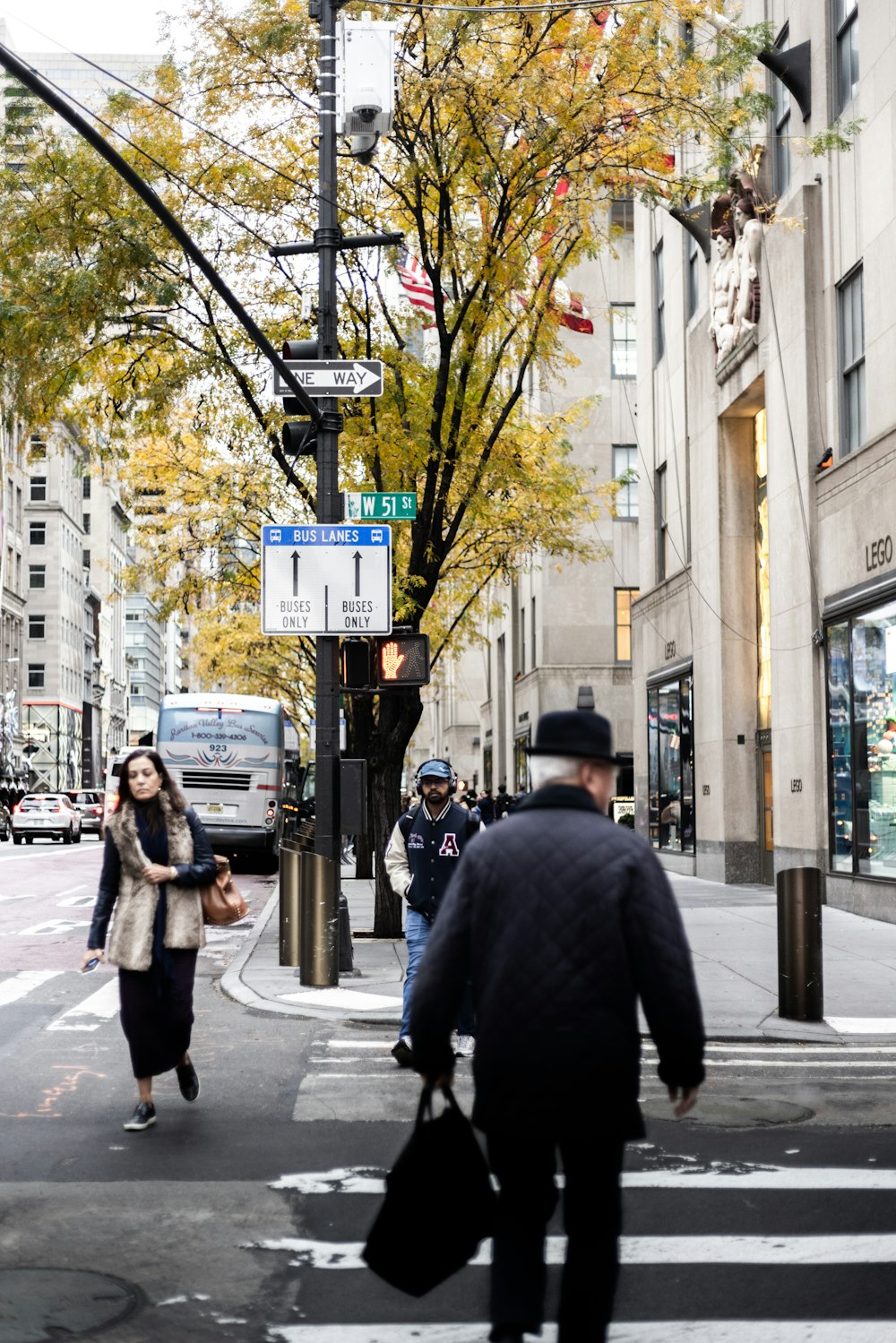 a man and a woman walking down a street