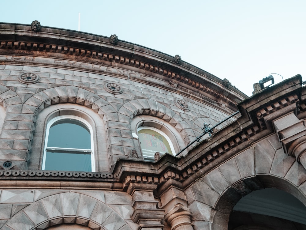 an old building with arched windows on a sunny day