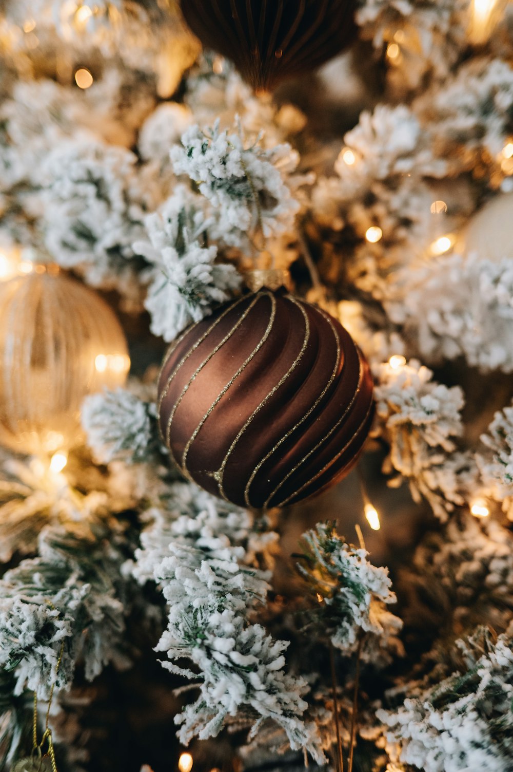 a close up of a christmas tree with ornaments