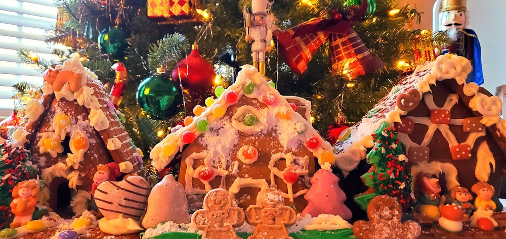 a group of gingerbread houses sitting on top of a table