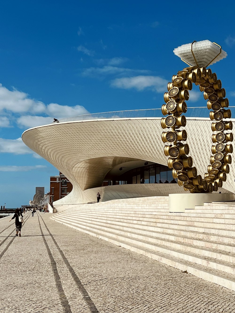 a building with a large sculpture in front of it