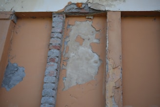 a brick wall with a hole in the middle of it