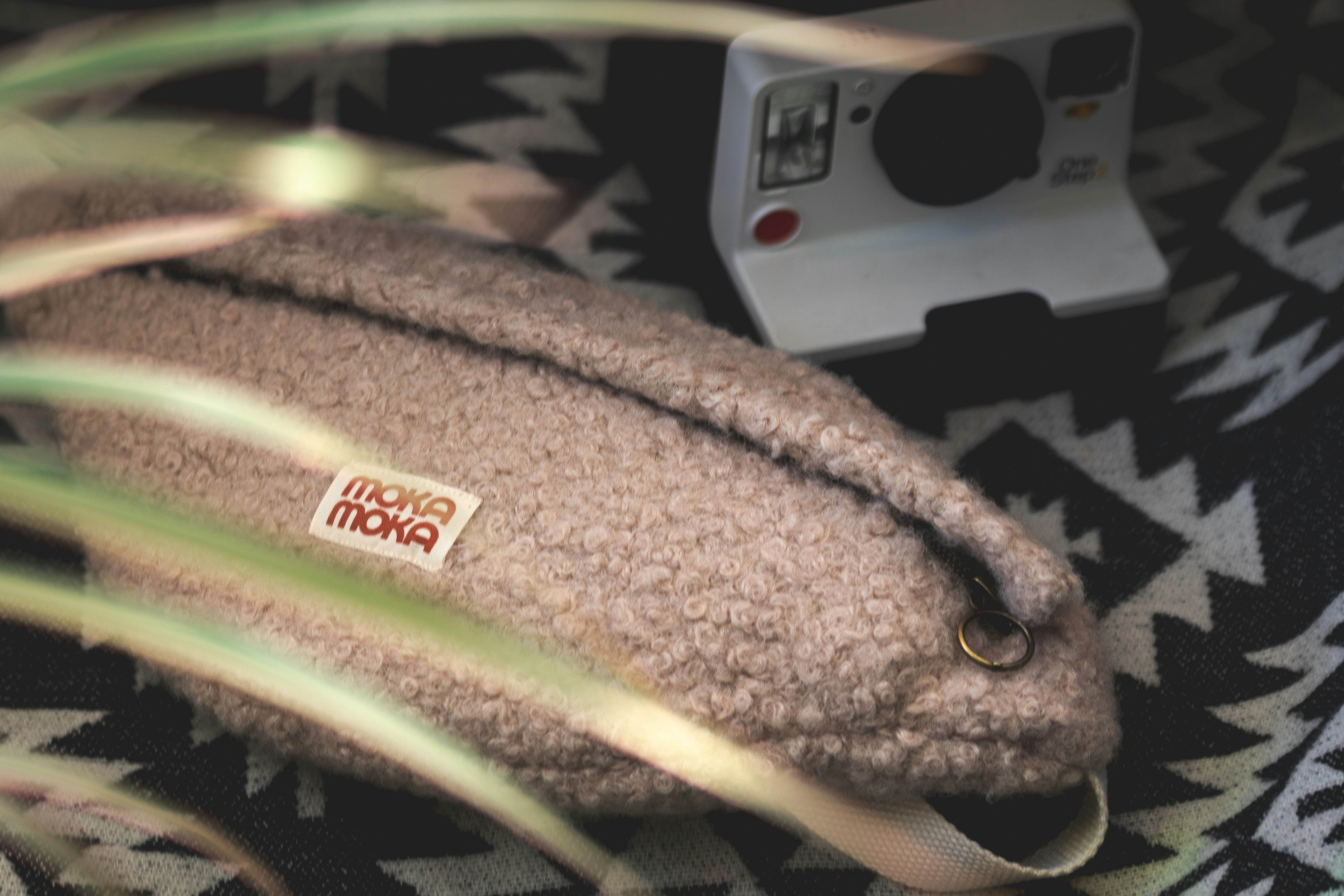 a close up of a camera and a bag