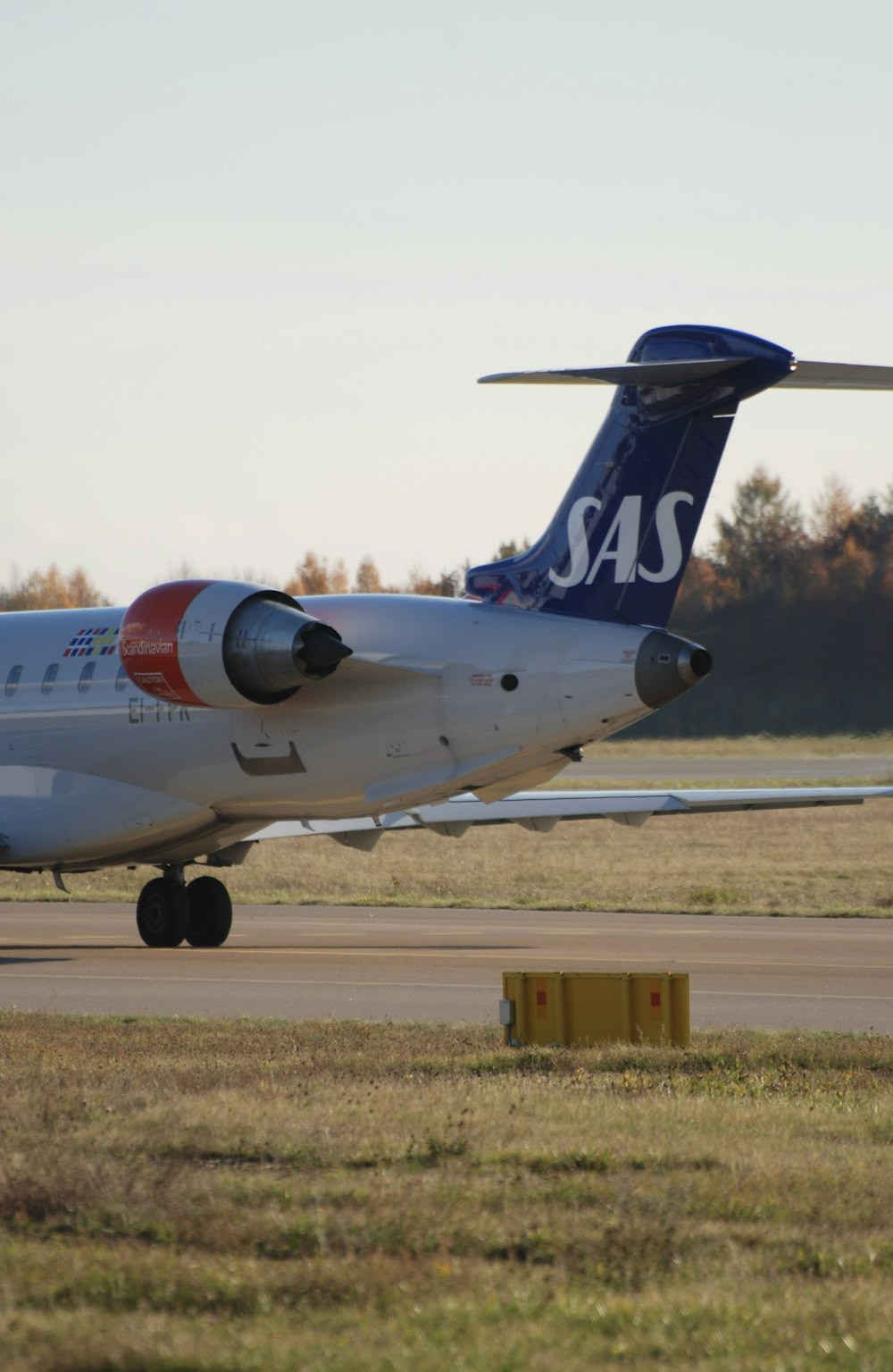 a large passenger jet sitting on top of an airport runway