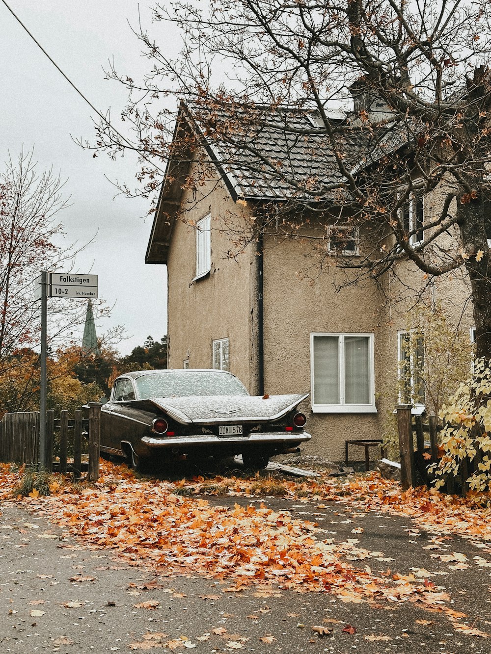 a car is parked in front of a house