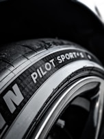 Close-up of high-performance summer tires on display.